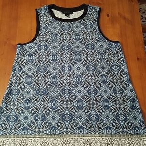 Loose fitting swing tank